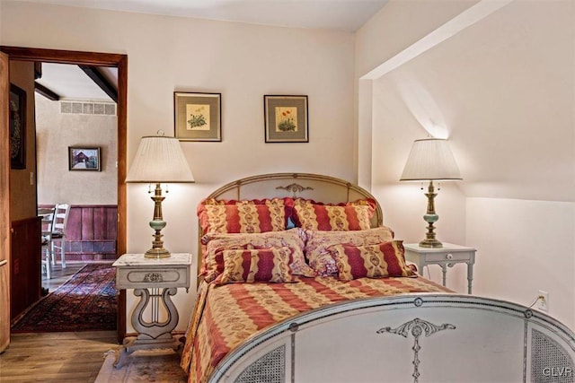 bedroom with wood-type flooring