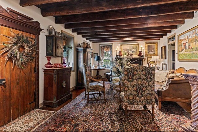 dining area with hardwood / wood-style floors and beamed ceiling