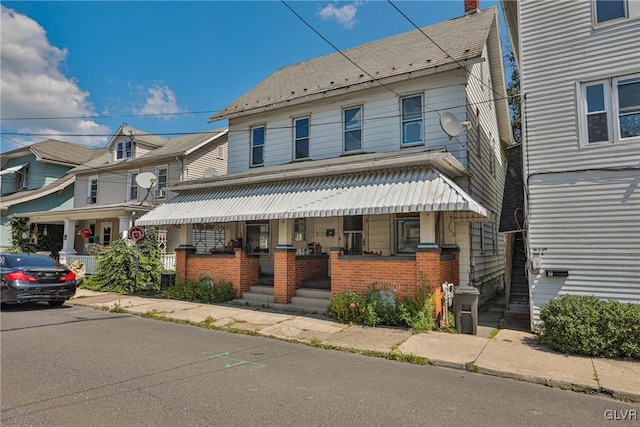 view of front of home featuring covered porch