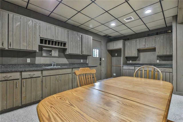 kitchen featuring a paneled ceiling and sink