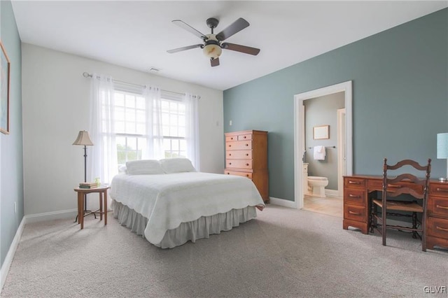 carpeted bedroom featuring connected bathroom and ceiling fan