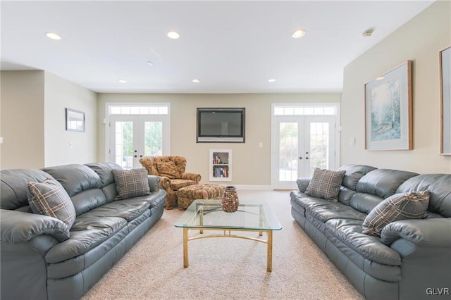 living room featuring carpet floors and french doors