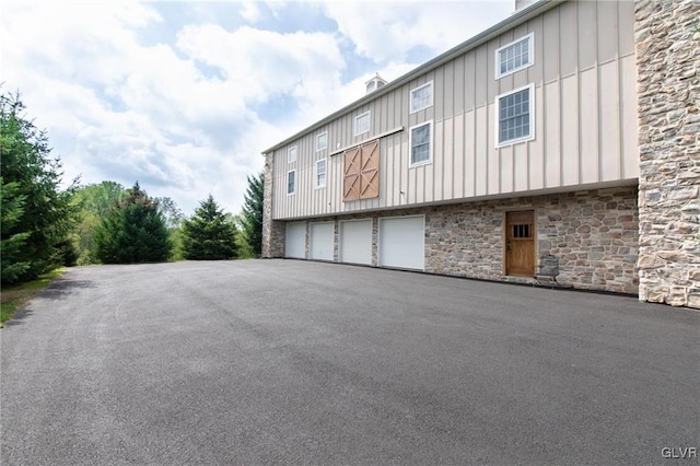 view of side of home with a garage