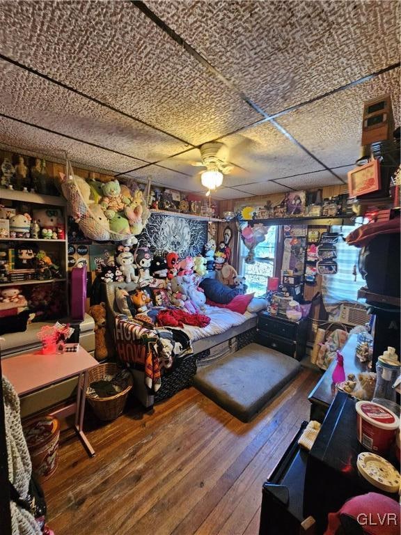 miscellaneous room with ceiling fan and wood-type flooring