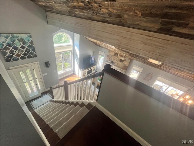 stairs with high vaulted ceiling