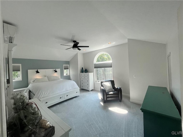 bedroom with ceiling fan, carpet floors, and lofted ceiling