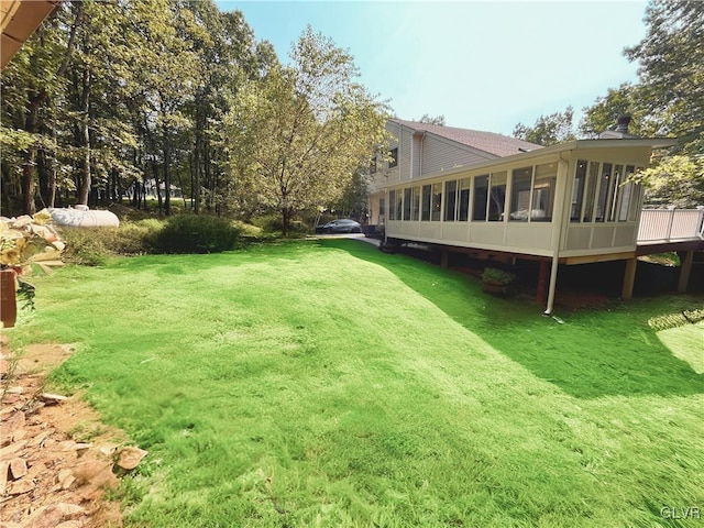 view of yard featuring a sunroom