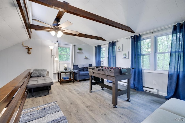 office featuring a baseboard radiator, ceiling fan, hardwood / wood-style floors, and vaulted ceiling with beams