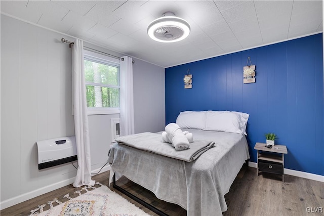 bedroom featuring dark hardwood / wood-style flooring