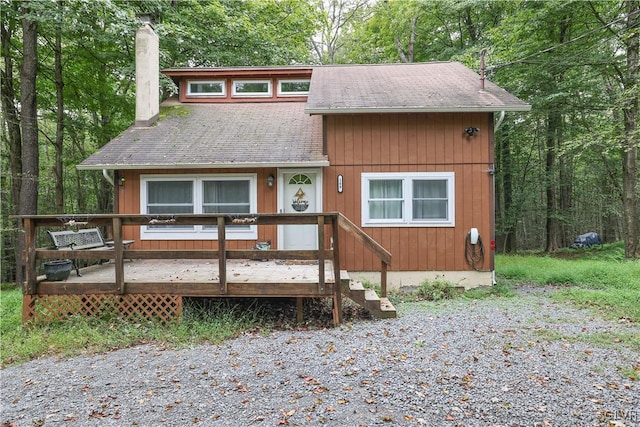 view of front facade with a wooden deck