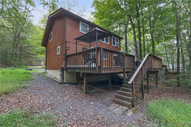 rear view of house with a deck