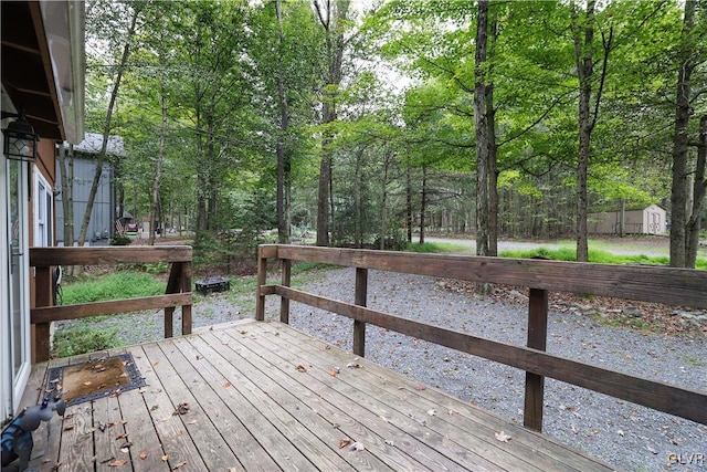 wooden terrace with a storage unit