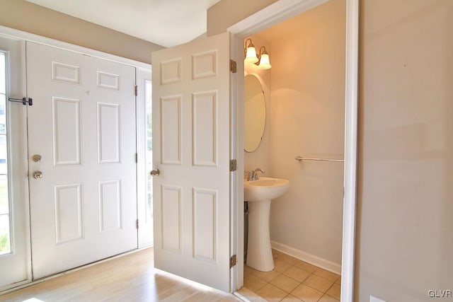 bathroom with hardwood / wood-style flooring and sink