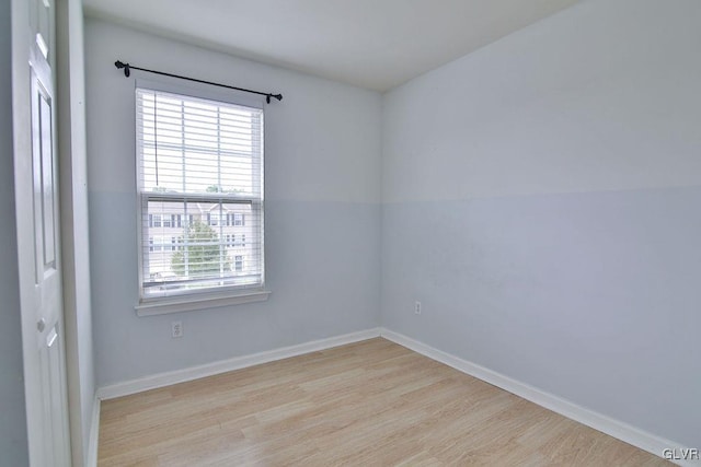 spare room with light hardwood / wood-style floors