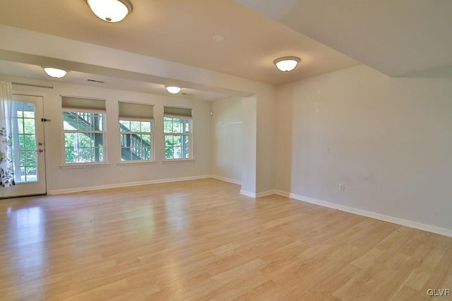 unfurnished room with light hardwood / wood-style floors