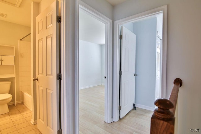 hallway with light wood-type flooring