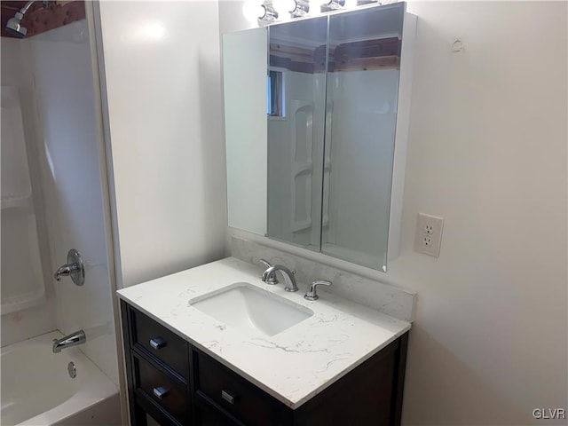 bathroom featuring vanity and shower / tub combination