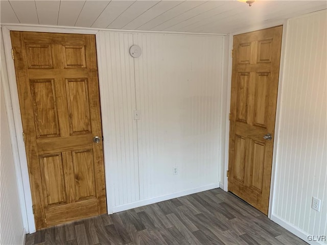 unfurnished room featuring dark hardwood / wood-style flooring