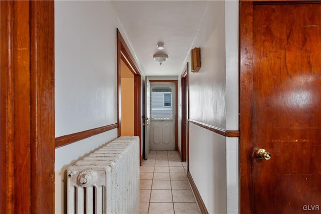 hall featuring light tile patterned flooring