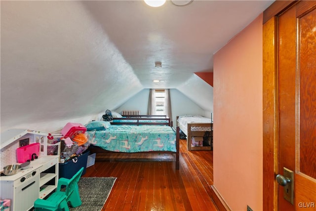 bedroom with lofted ceiling and dark hardwood / wood-style flooring