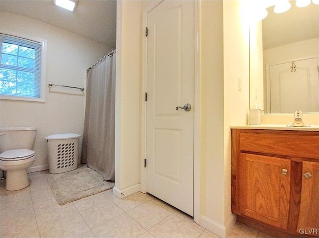 bathroom featuring vanity, toilet, curtained shower, and tile patterned flooring