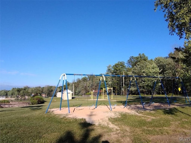 view of playground with a lawn