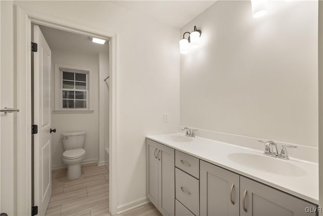 full bathroom with vanity, toilet, and shower / tub combination