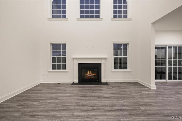 unfurnished living room with hardwood / wood-style flooring