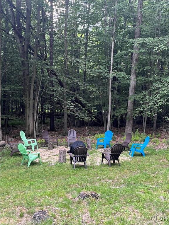 view of yard with a fire pit