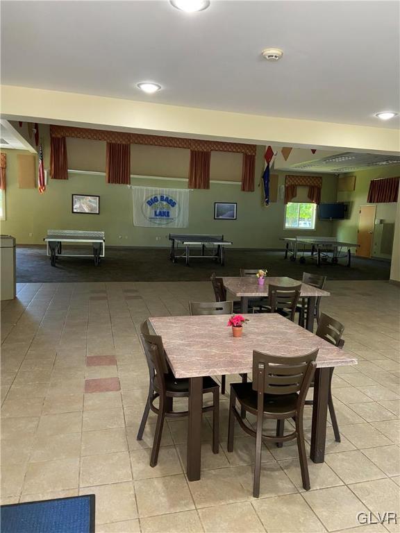 tiled dining space with billiards