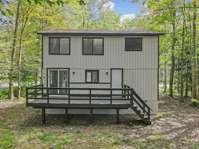 223 Wyalusing Dr, Coolbaugh Twp, PA 18347 - view of front facade featuring a wooden deck