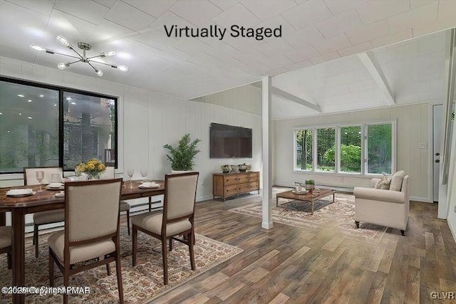 223 Wyalusing Dr, Coolbaugh Twp, PA 18347 - dining space with lofted ceiling with beams and wood finished floors