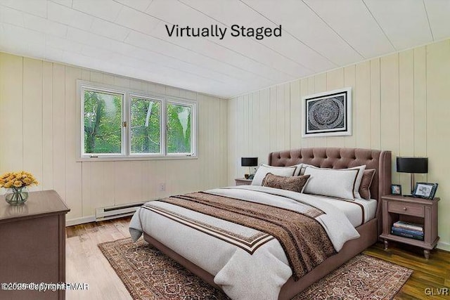 223 Wyalusing Dr, Coolbaugh Twp, PA 18347 - bedroom with baseboard heating and wood finished floors