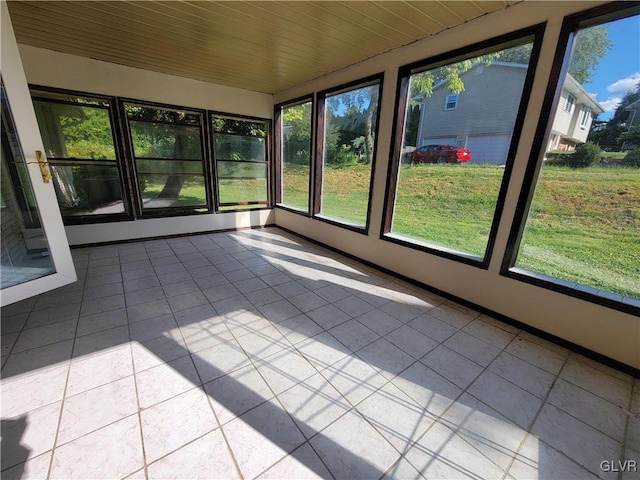 unfurnished sunroom featuring wooden ceiling