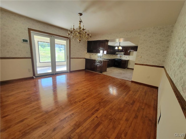 interior space with light hardwood / wood-style flooring and a notable chandelier