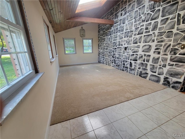 interior space featuring vaulted ceiling, wood ceiling, and carpet floors