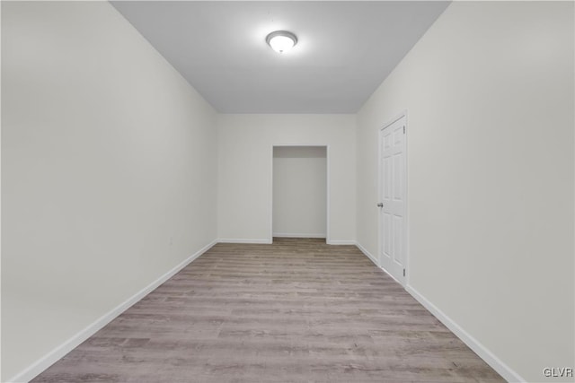 spare room featuring light wood-type flooring