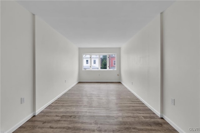 unfurnished room with hardwood / wood-style floors