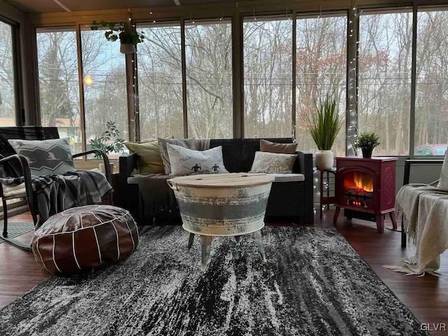 sunroom with a wood stove