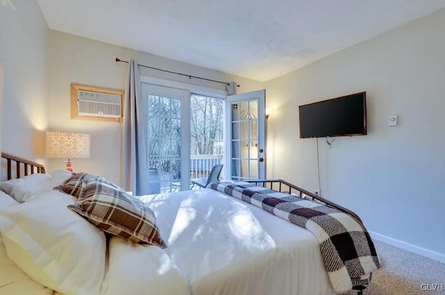 bedroom featuring carpet flooring, a wall mounted air conditioner, and baseboards