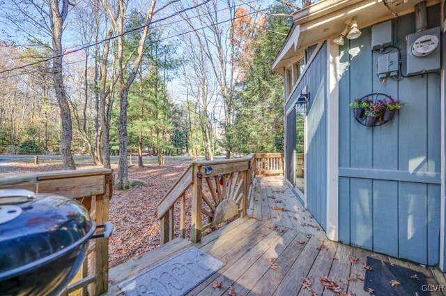 wooden deck featuring area for grilling