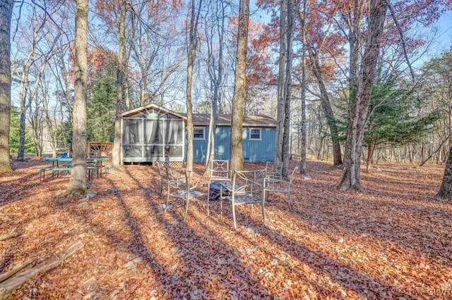 view of yard with a sunroom