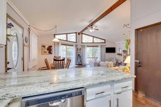 kitchen with white cabinetry, light stone countertops, ceiling fan, lofted ceiling with beams, and stainless steel dishwasher