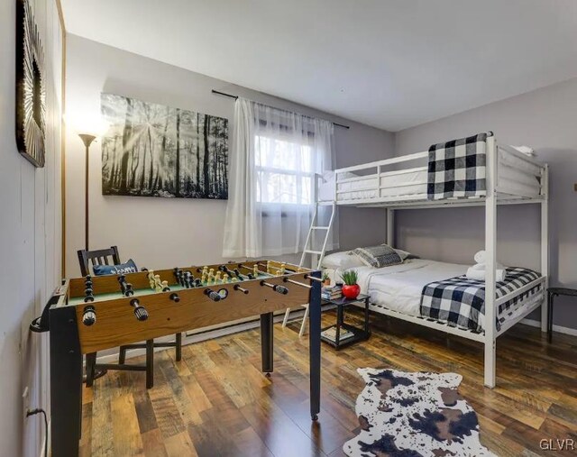 bedroom featuring wood finished floors