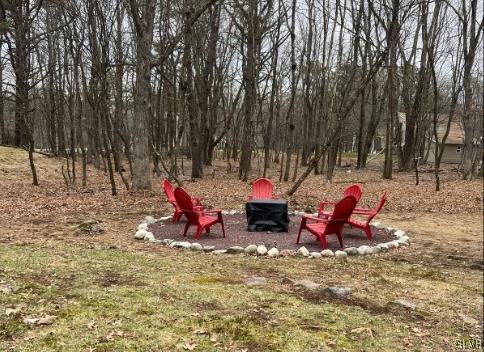 view of yard with a fire pit