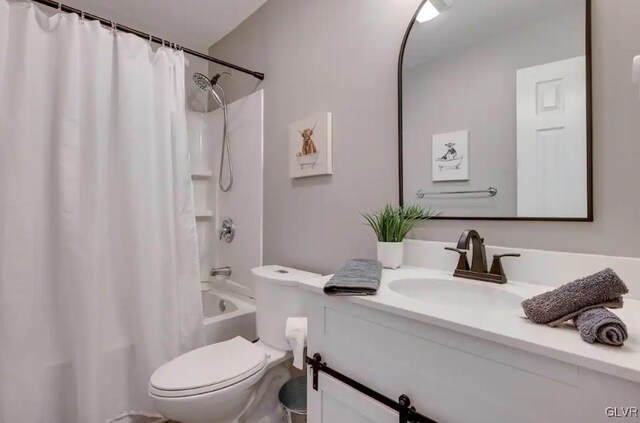 full bathroom featuring vanity, toilet, and shower / tub combo