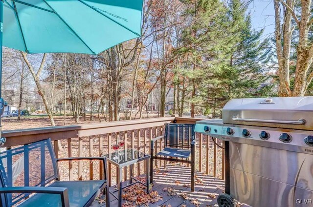 wooden deck with grilling area