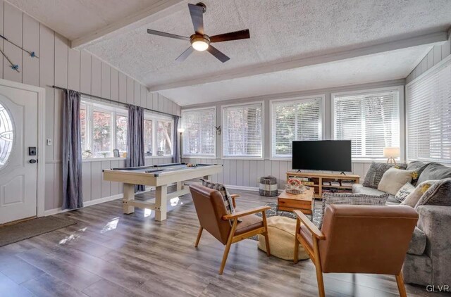 living room featuring billiards, a textured ceiling, wood-type flooring, ceiling fan, and vaulted ceiling with beams