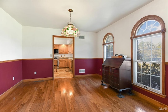 miscellaneous room featuring hardwood / wood-style floors