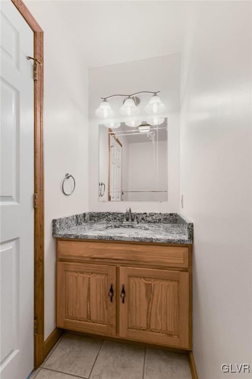 bathroom with vanity and tile patterned floors